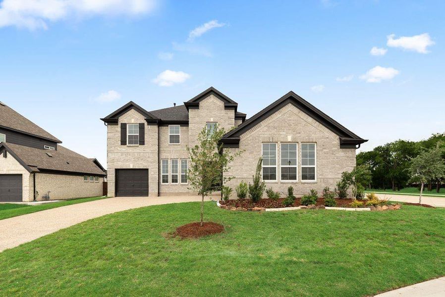 Front exterior of a new home in Dominion of Pleasant Valley, Wylie, TX, highlighting curb appeal (Image 2). Front exterior of a new home in Dominion of Pleasant Valley, Wylie, TX, highlighting curb appeal (Image 2).