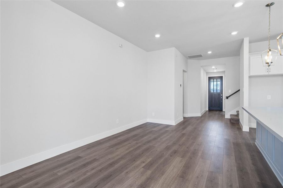 This dining area is a natural extension of the kitchen and living room, allowing for seamless conversation and connection with guests or family members, even when preparing a meal.