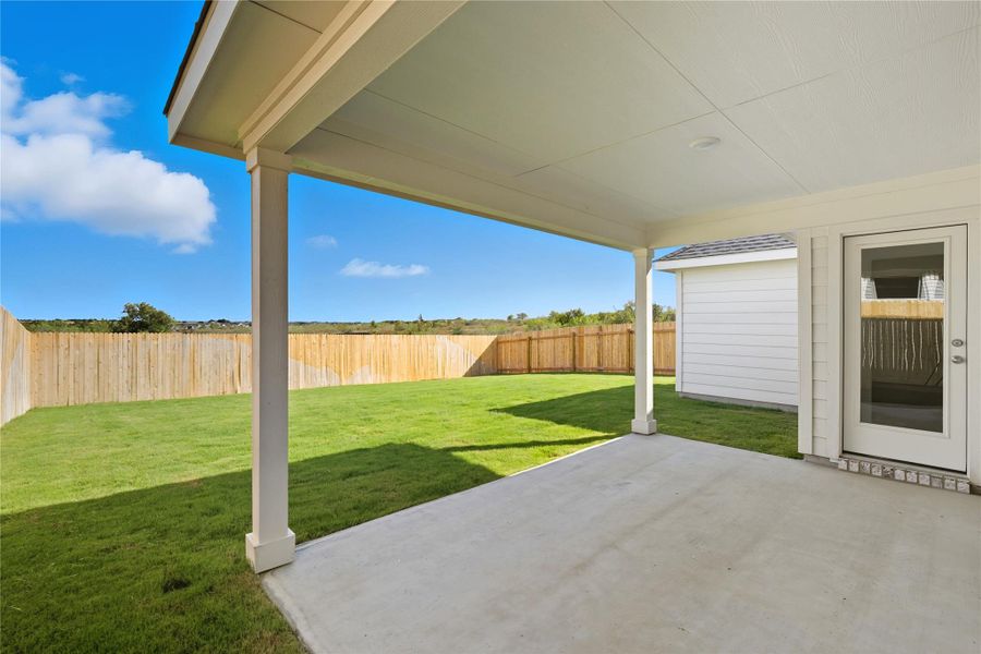 Fenced backyard featuring a patio Fenced backyard featuring a patio