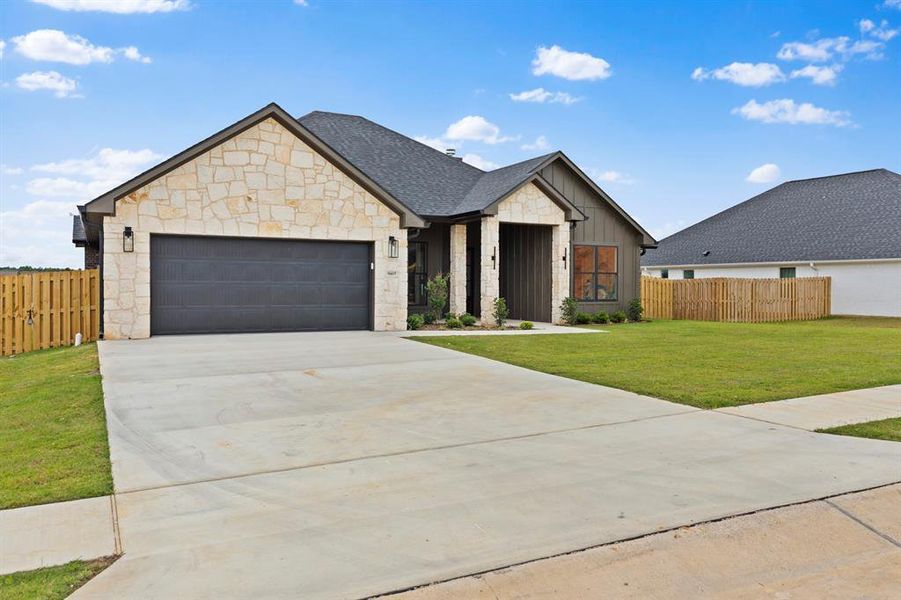 Front exterior of a new home in , Lindale, TX, highlighting curb appeal (Image 25).