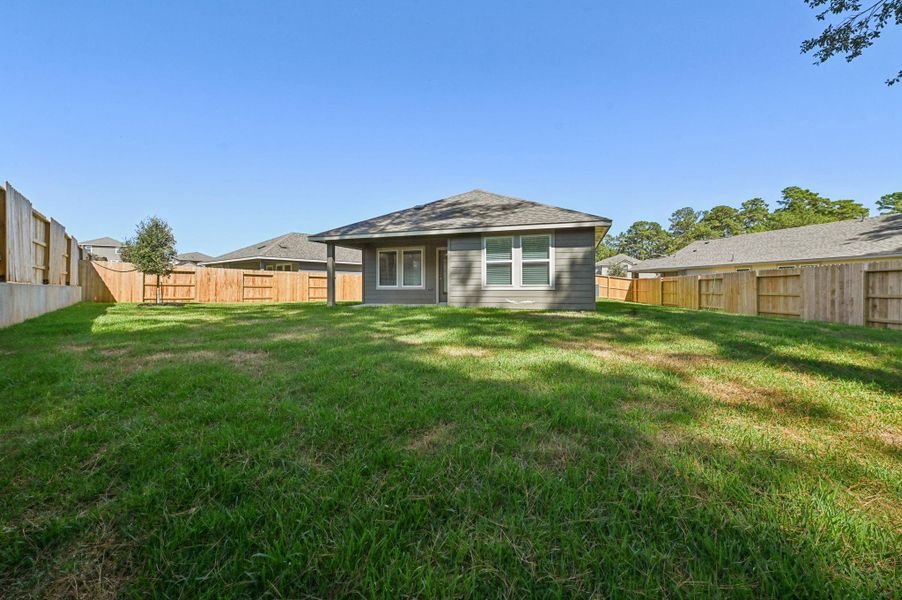 Exterior details and patio area of a home in , Conroe (Image 20).