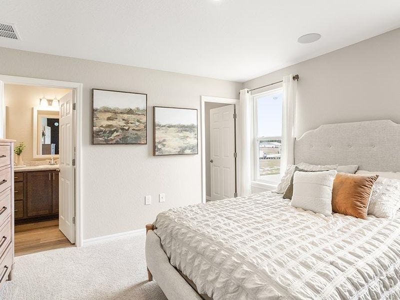 Upstairs, rest and relaxation await in your private owner`s suite - Isla townhome by Highland Homes