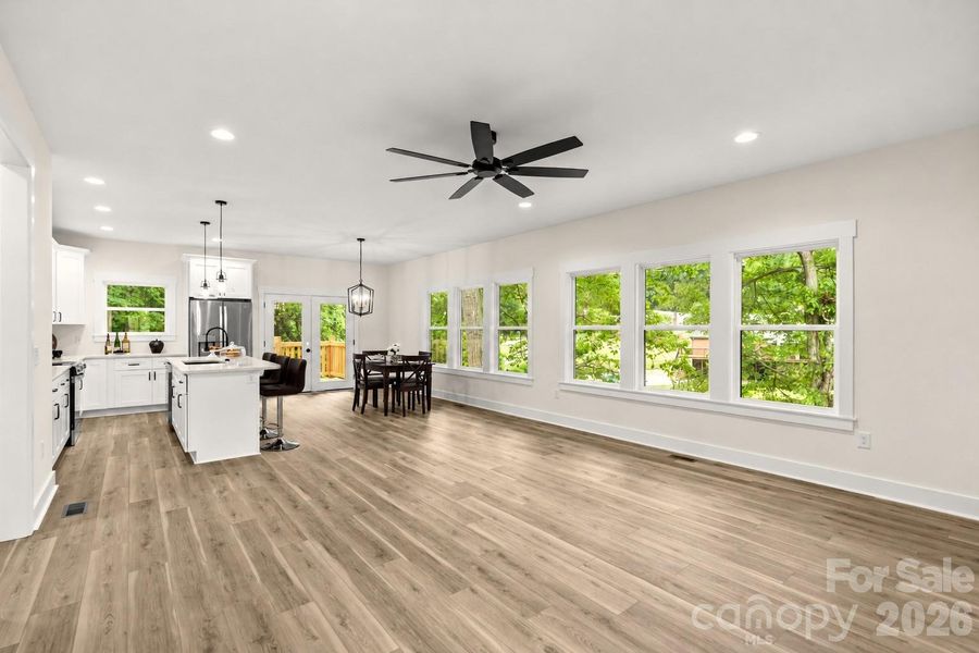 Open floor plan & shows how much light in main living areas.