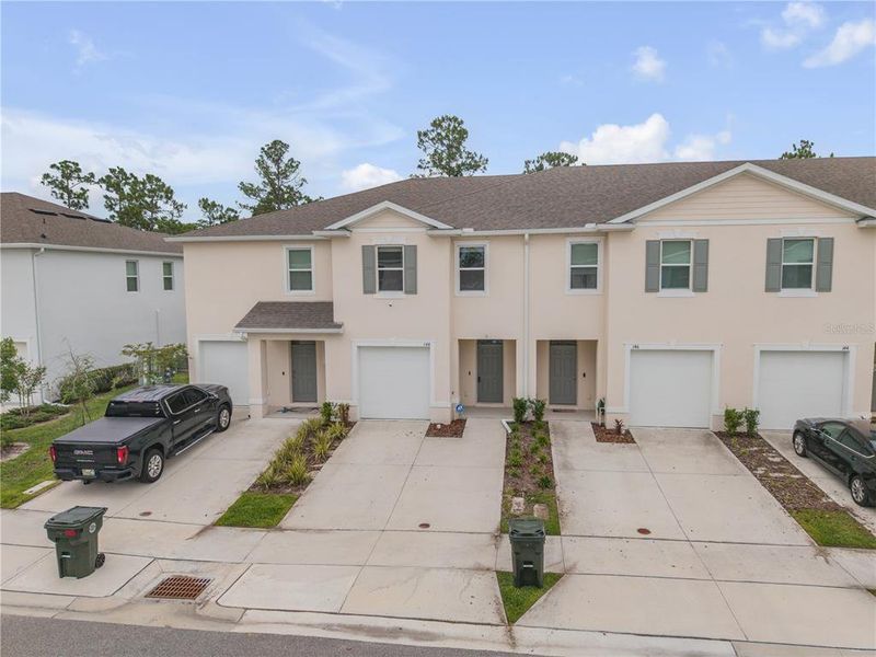 Front exterior of a new home in , Daytona Beach, FL, highlighting curb appeal (Image 25). Front exterior of a new home in , Daytona Beach, FL, highlighting curb appeal (Image 25).