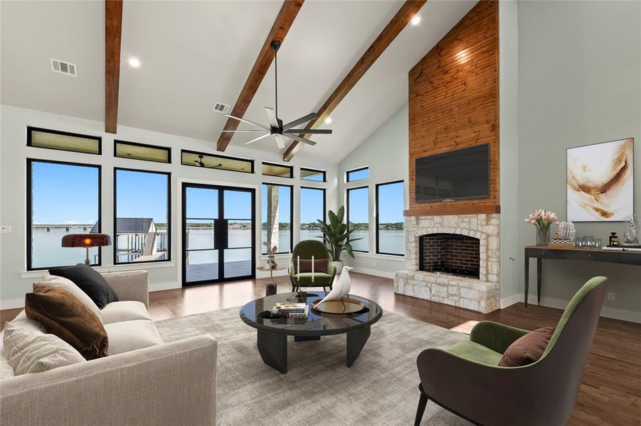 Virtually Staged-Stunning stone wood-burning fireplace. Natural light pours through expansive lakeside windows.