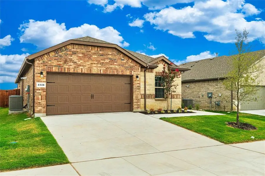 Front exterior of a new home in , Haslet, TX, highlighting curb appeal (Image 1). Front exterior of a new home in , Haslet, TX, highlighting curb appeal (Image 1).