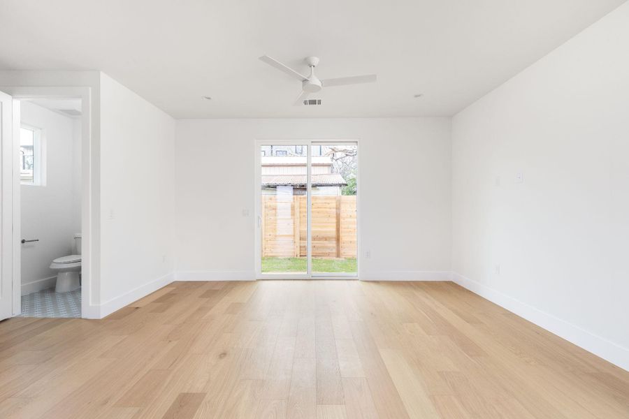 Unfurnished room with light wood-style floors and ceiling fan