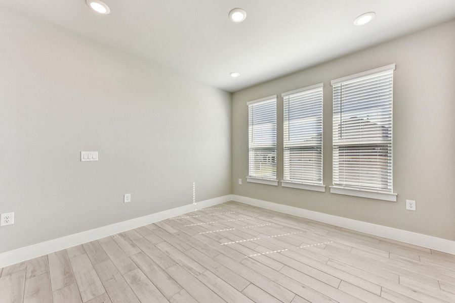Spare room featuring recessed lighting and light wood-style flooring
