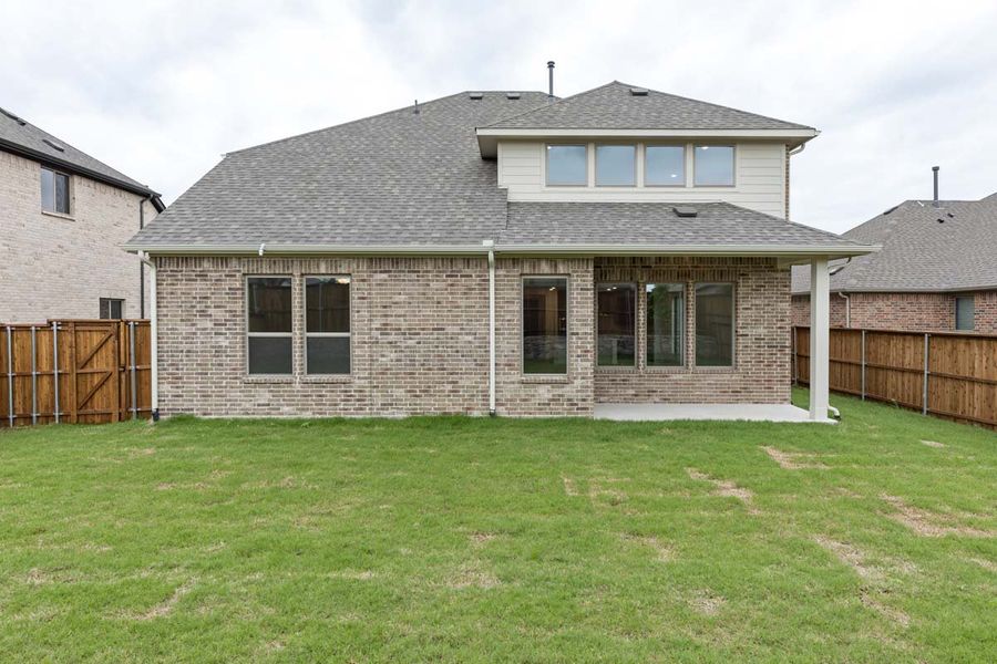 Exterior details and patio area of a home in River Ranch, Van Alstyne (Image 4). Exterior details and patio area of a home in River Ranch, Van Alstyne (Image 4).