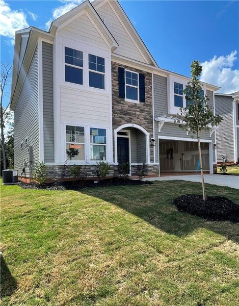 Front exterior of a new home in Springwood Grove, Central, SC, highlighting curb appeal (Image 1).