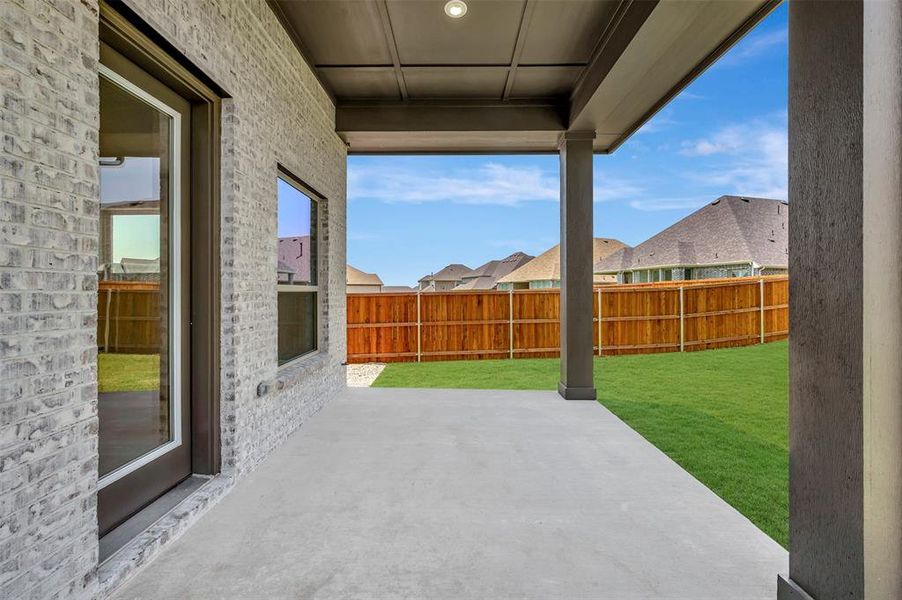 Covered patio featuring a concrete slab and painted ceiling with recessed lighting