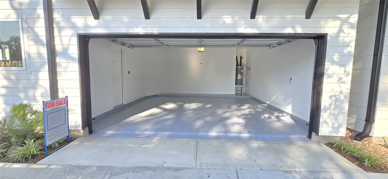 Garage floor with textured epoxy coating. Garage floor with textured epoxy coating.