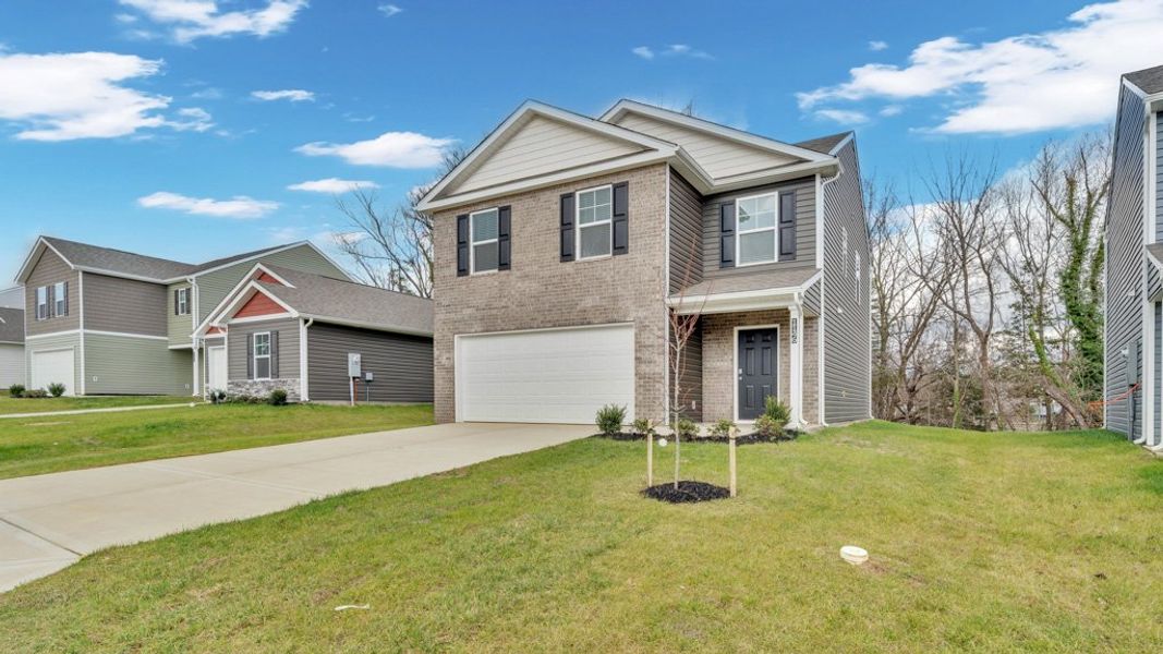 Front exterior of a new home in Johnson Farms, Greeneville, TN, highlighting curb appeal (Image 2). Front exterior of a new home in Johnson Farms, Greeneville, TN, highlighting curb appeal (Image 2).