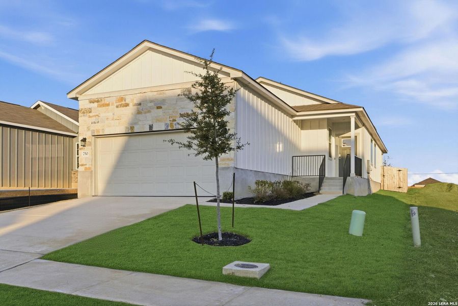 Front exterior of a new home in Highland Ridge, San Antonio, TX, highlighting curb appeal (Image 16).