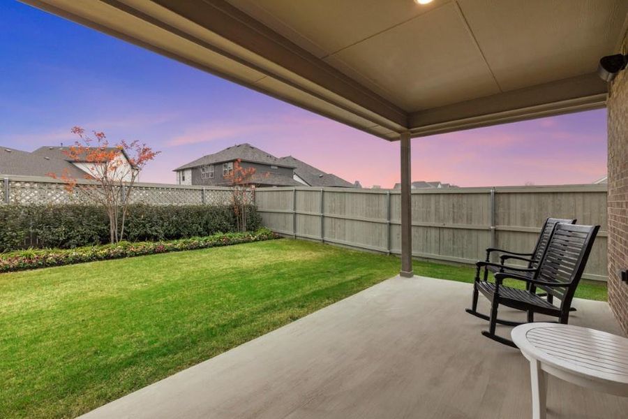 Exterior details and patio area of a home in Pecan Square, Northlake (Image 22).