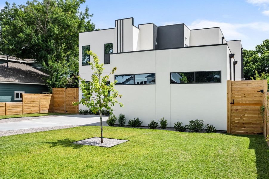 A striking modern facade with clean lines and contrasting dark accents highlights this exceptional property. A striking modern facade with clean lines and contrasting dark accents highlights this exceptional property.