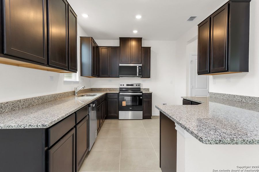 Furnished interior view inside a new home in Southton Cove, Elmendorf (Image 3).