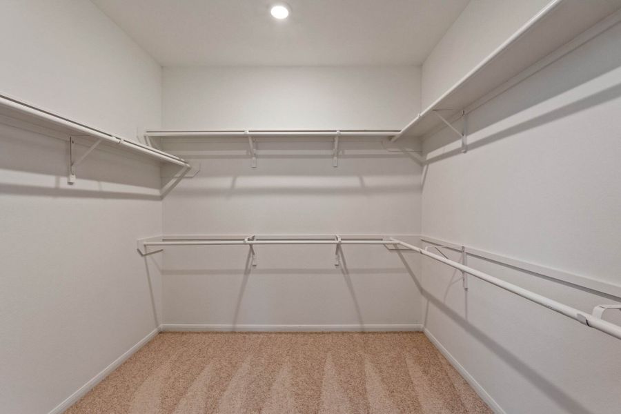 A view of the primary bedrooms' walk in closet.