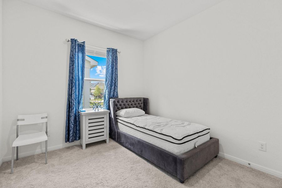 Bedroom with carpet and baseboards Bedroom with carpet and baseboards