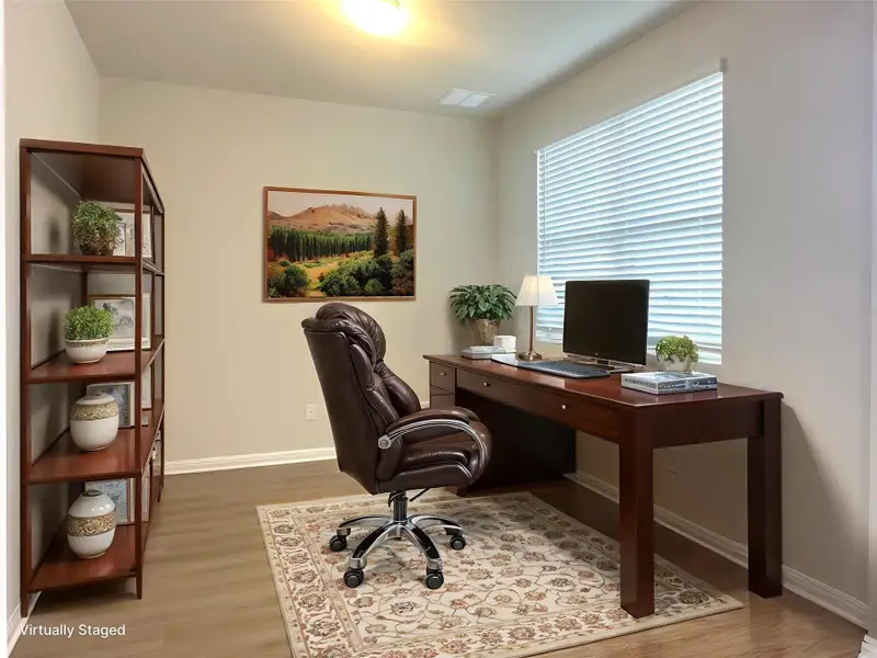 Office area with LVP floors and baseboards