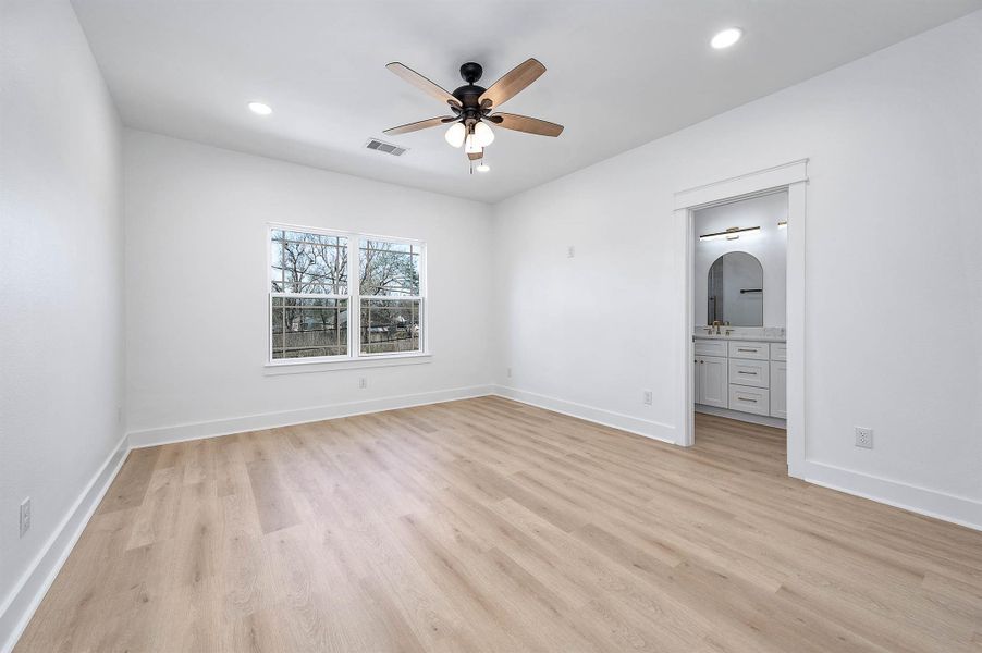 Generous primary bedroom designed for comfort and relaxation.