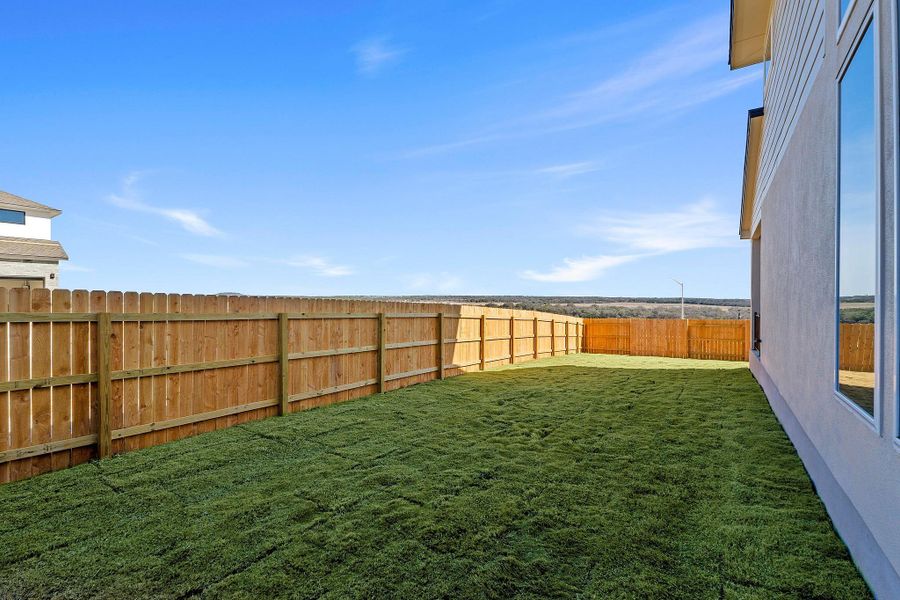 Exterior details and patio area of a home in Lariat, Liberty Hill (Image 4).