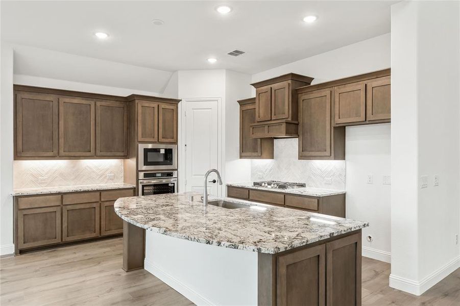 Furnished interior view inside a new home in Stone River Glen 60s, Royse City (Image 8).