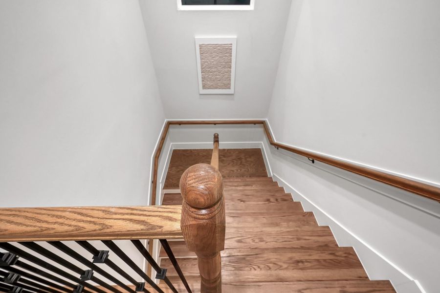 Wide hallway leads to your back sanctuary, secondary rooms, utility and half story office.