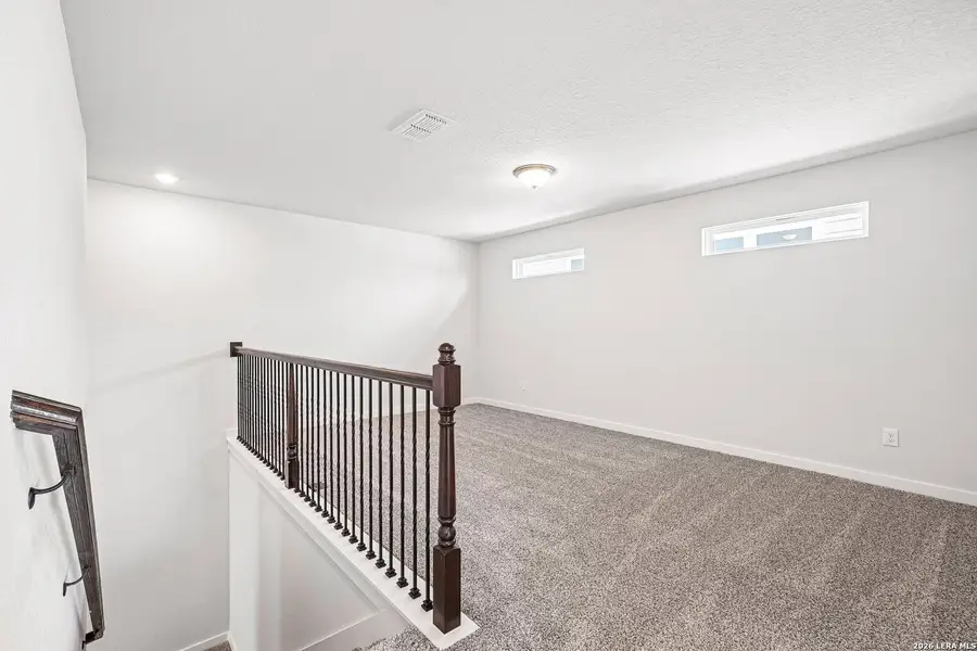 Spacious, unfurnished interior of a new home in Weston Oaks, San Antonio (Image 17).