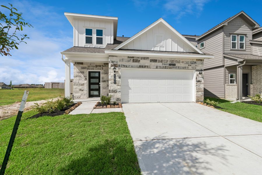 Front exterior of a new home in The Canopies, Splendora, TX, highlighting curb appeal (Image 2). Front exterior of a new home in The Canopies, Splendora, TX, highlighting curb appeal (Image 2).