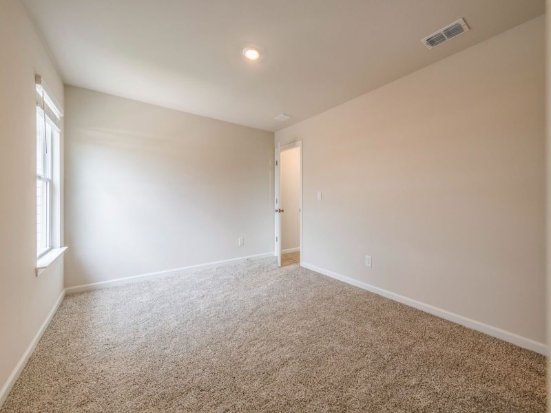 Two secondary bedrooms round out the upstairs.