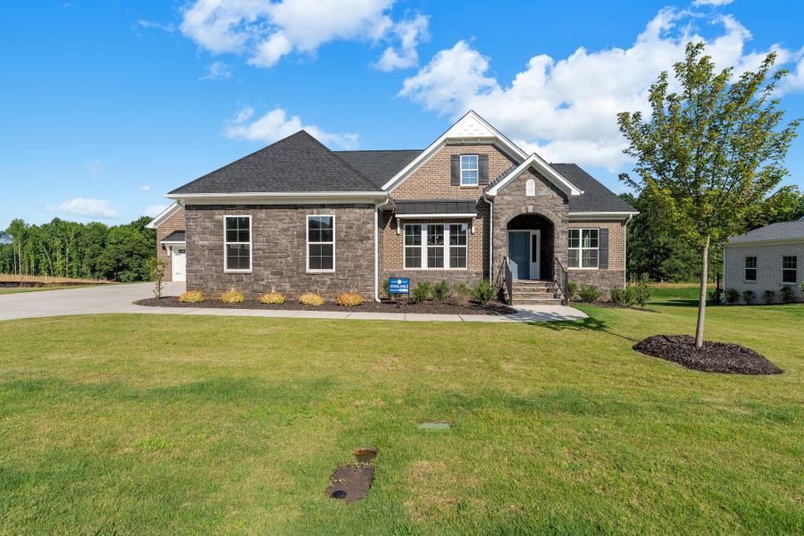 Front exterior of a new home in Walnut Grove, Easley, SC, highlighting curb appeal (Image 1). Front exterior of a new home in Walnut Grove, Easley, SC, highlighting curb appeal (Image 1).