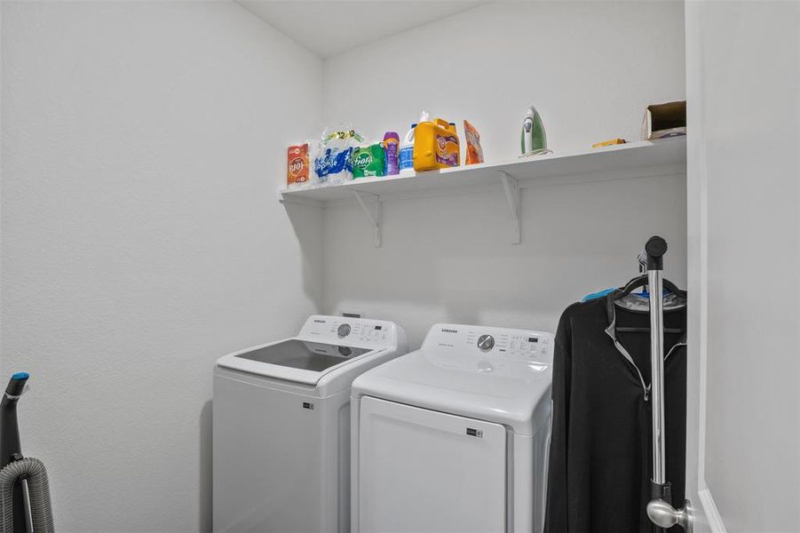 Washroom featuring washer and dryer