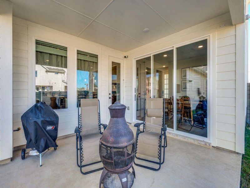 Exterior details and patio area of a home in Terrace Collection at Harvest, Argyle (Image 21).