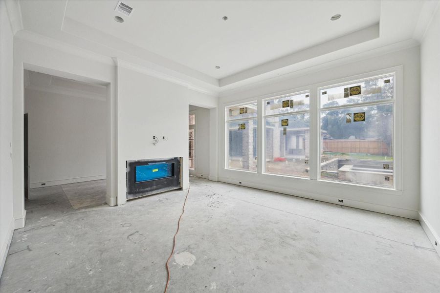 Progress photo from December 2025 - Primary bedroom with sitting area and double-sided fireplace