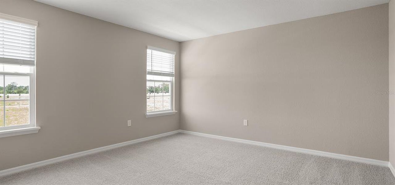 Spacious, unfurnished interior of a new home in Estates at Hickory Cove - Bungalows, St. Cloud (Image 10).