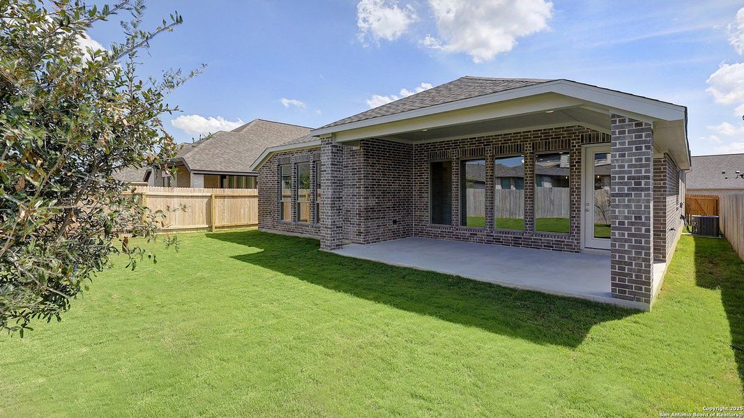 Exterior details and patio area of a home in Kallison Ranch 50', San Antonio (Image 31).
