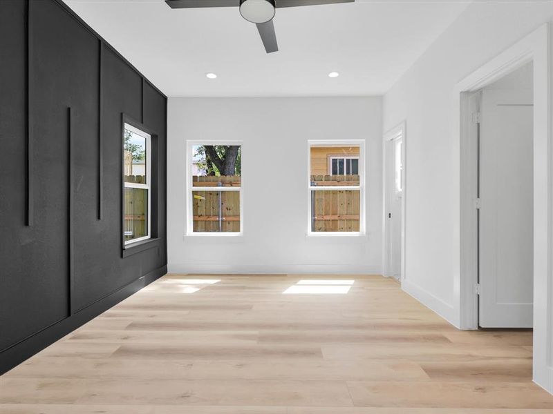 Hallway with light hardwood / wood-style flooring