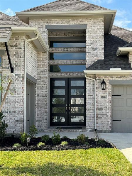 Dramatic entry with 8’ Wood & Glass Double Doors