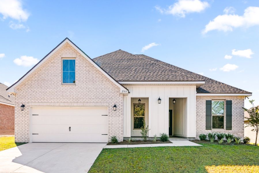Front exterior of a new home in Young Oaks, Crestview, FL, highlighting curb appeal (Image 1).