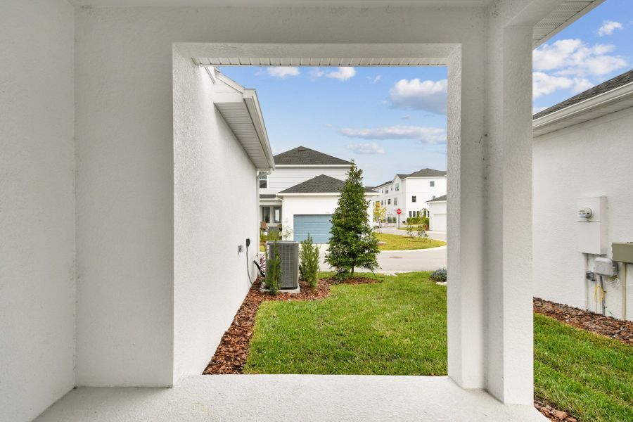 Exterior details and patio area of a home in Emerald Landing at Waterside at Lakewood Ranch – Cottage Series, Sarasota (Image 4).