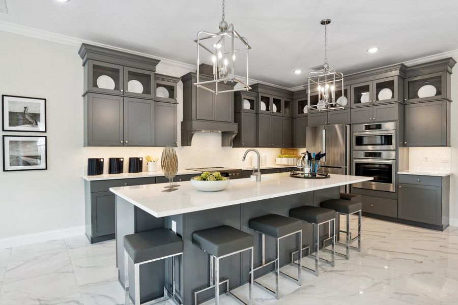 Kitchen with pendant lighting and glass upper cabinets