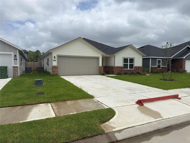 Front exterior of a new home in , Dayton, TX, highlighting curb appeal (Image 1). Front exterior of a new home in , Dayton, TX, highlighting curb appeal (Image 1).