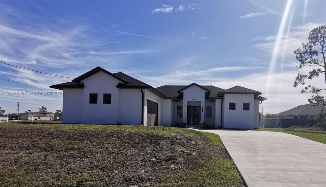 Front exterior of a new home in , Cape Coral, FL, highlighting curb appeal (Image 21).