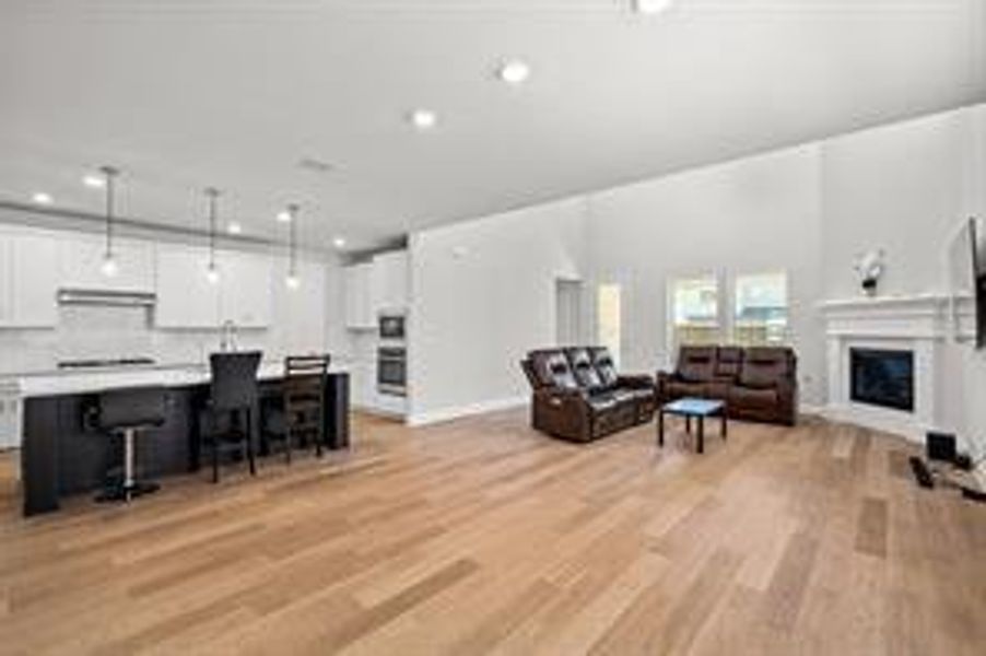 Living room with light hardwood / wood-style flooring