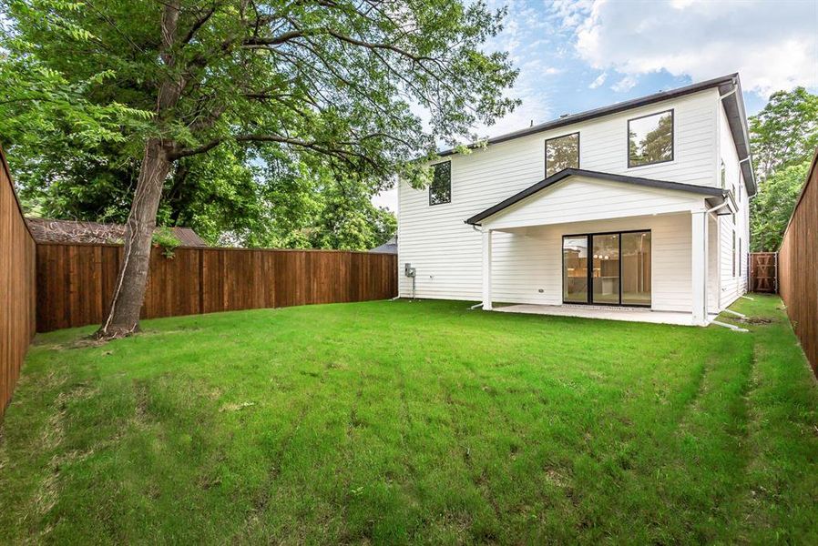 Rear view of house featuring a patio area