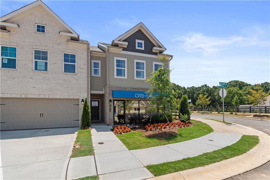 Front exterior of a new home in Abbotts Crossing, Conyers, GA, highlighting curb appeal (Image 24).