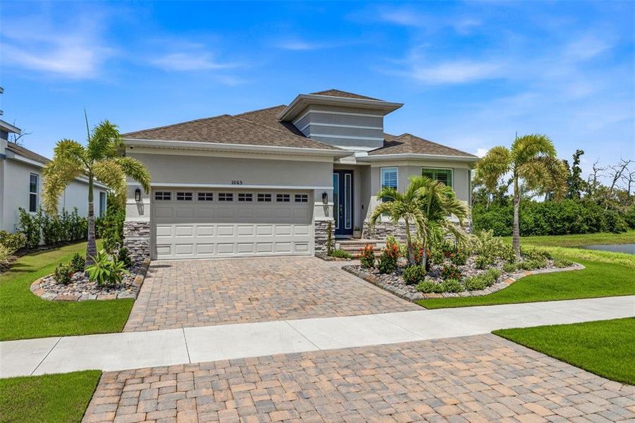Front exterior of a new home in , Apollo Beach, FL, highlighting curb appeal (Image 2). Front exterior of a new home in , Apollo Beach, FL, highlighting curb appeal (Image 2).