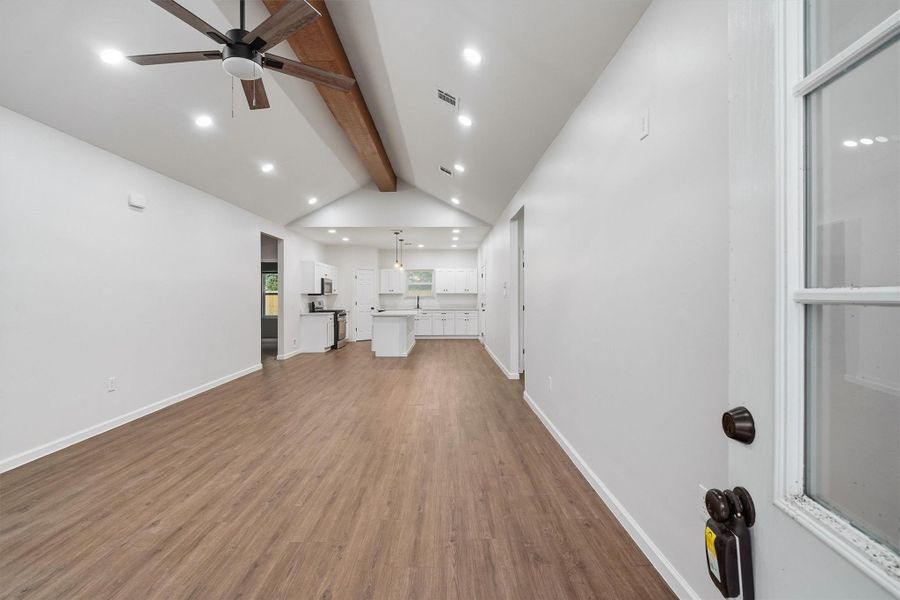 Brand new! Fresh paint, modern flooring and exposed beam