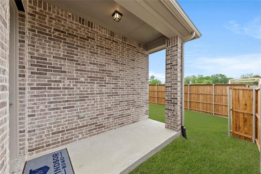 Exterior details and patio area of a home in Villas at Long Branch, Rowlett (Image 3).